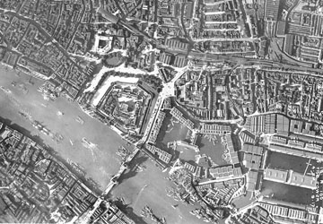 The Tower of London and Tower Bridge, with Fenchurch Street railway station in the top left-hand corner, as seen form the air in 1917.