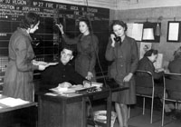 Oldham women during World War Two working in a civil defence centre, co-ordinating fire engine call outs.