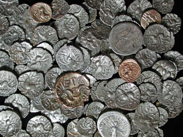 Some of the 5,000 silver and gold coins found at the Hallaton shrine, the majority of which were made by the local Corieltavi tribe (formerly thought to be called the Coritani). © Leicestershire County Council.